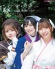 A group of three young women dressed in traditional Japanese clothing.